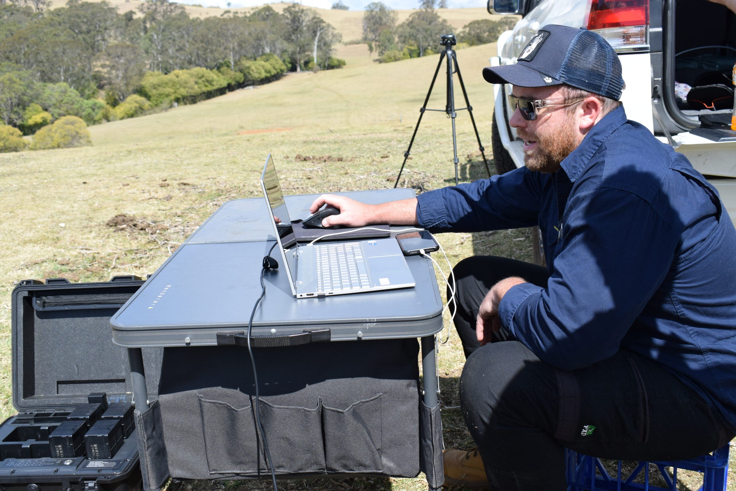DSC_0219 Surveyor checking survey data on a laptop in the field
